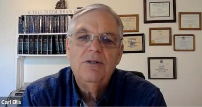 Carl Ellis in his office; screenshot from video