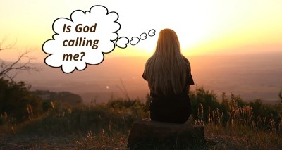 A woman  gazing at sunset from atop a high point; speech bubble says: "Is God calling me?"